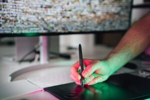 Male Hand Drawing on a Graphic Tablet with a Pencil